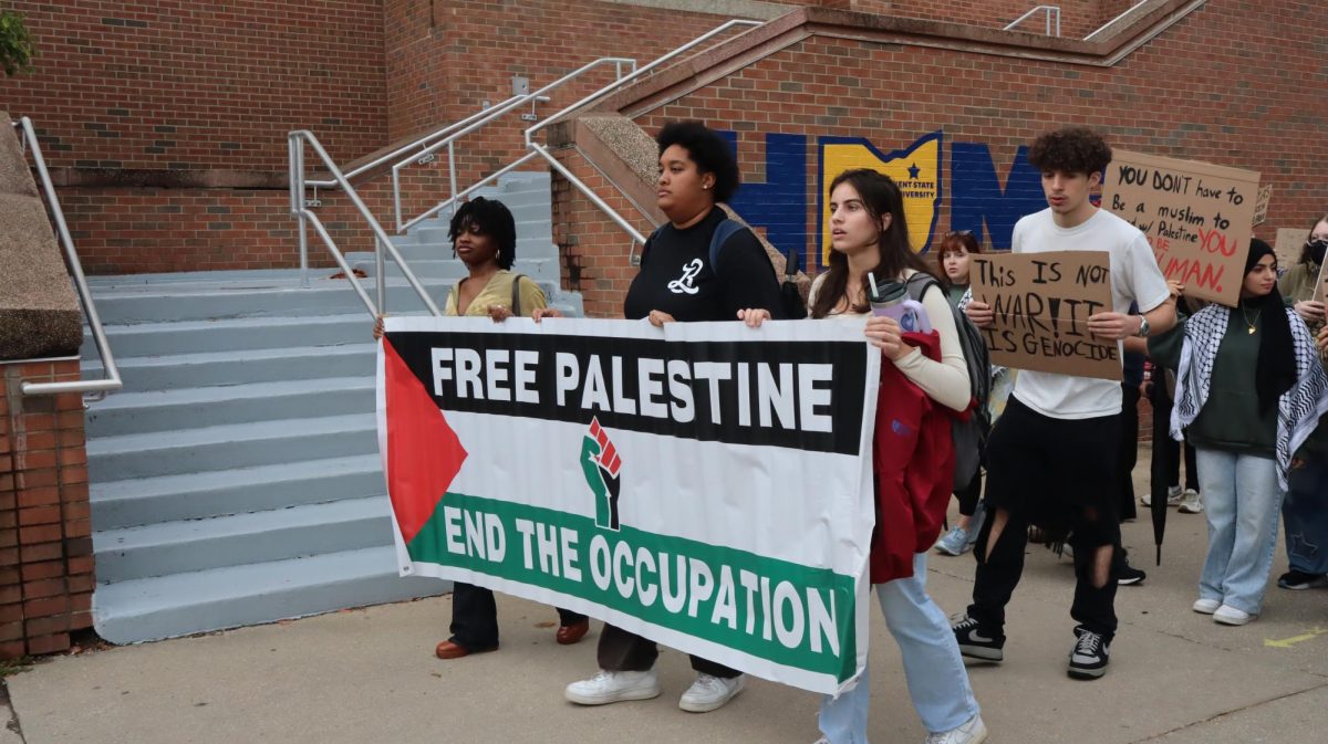 After meeting on Risman Plaza to listen to speakers reflect on the ongoing Israel-Gaza conflict, those attending the Students for Justice in Palestine protest made their way to the rock on Tuesday, Oct. 7, 2025.