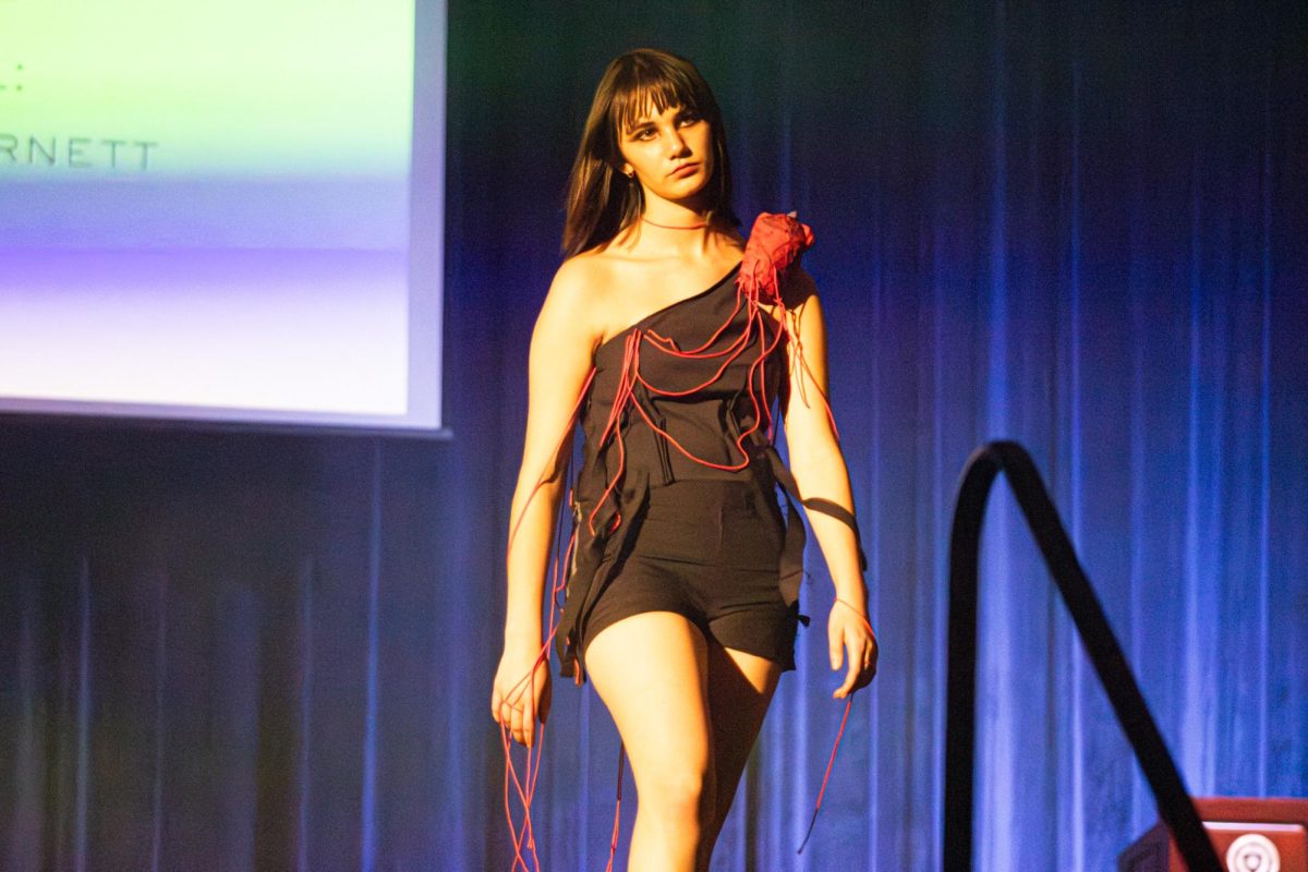 Emory Cornett walks Kents ballroom runway wearing Lilly Hurell at Modista fashion show October 18,2025 