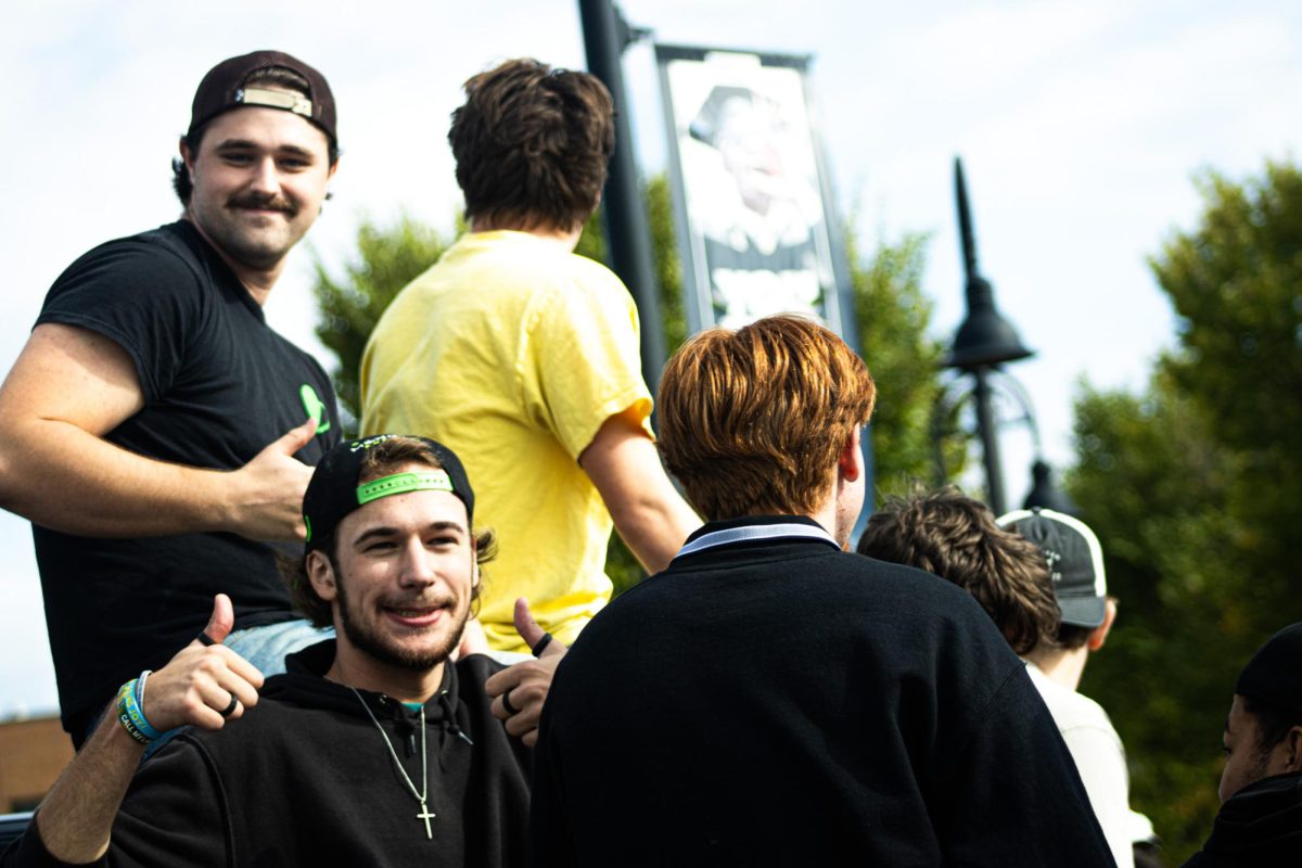 Greek Life students sit in a float in the homecoming parade on Oct. 11, 2025. 