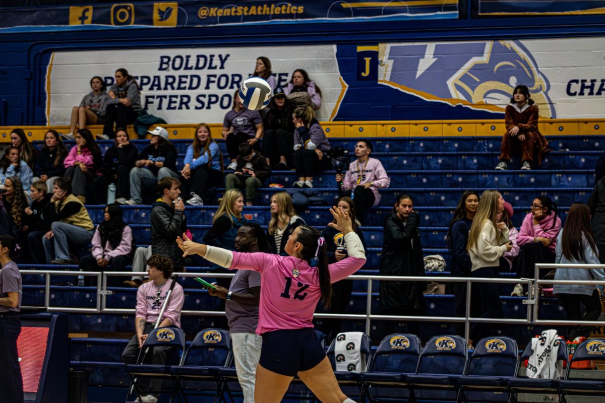 Kent States Number 12, Catie Patterson sets up to make a serve against Central Michigan Chippewas Oct. 24, 2025
