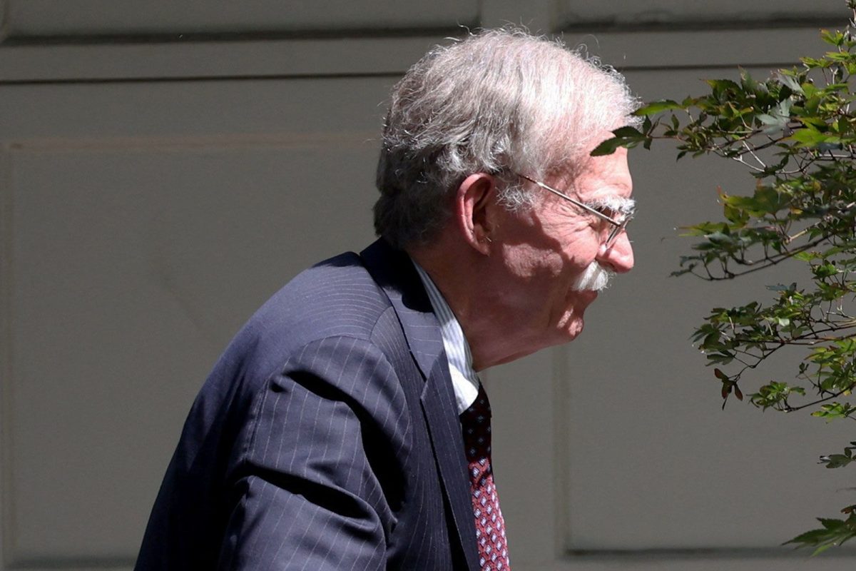 Former White House national security adviser John Bolton arrives at his house in Bethesda, Maryland, following its search by the FBI on August 22.