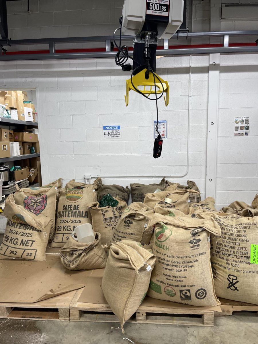 Bent Tree Coffee's newly installed crane prepares to lift one of the bags of green coffee. 