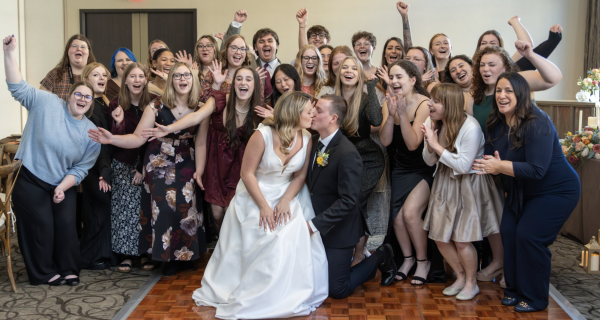From left to right, the Wedding and Special Events Proctol class poses with Brooklyn Flocker Leshon, Alexa Frena, Logan Wilson and Mandy Ulicney after their rooftop ceremony on Oct. 28.