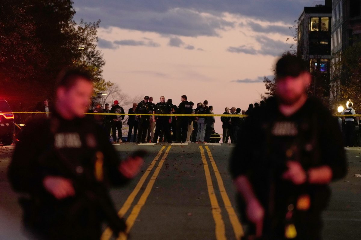 Emergency personnel keep a presence following the shooting of two National Guard soldiers near the White House on Wednesday, November 26 in Washington.