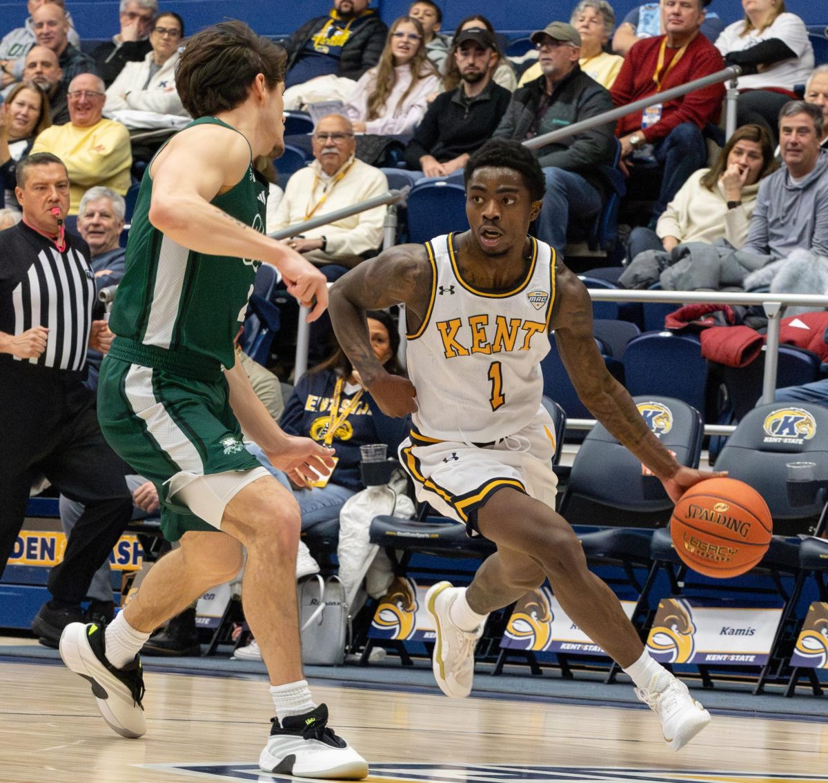 Kent junior Cian Medley dribbles the ball down the court as Ohio University senior Ajay Sheldon defends him during the first half of their game on Jan. 28, 2026.