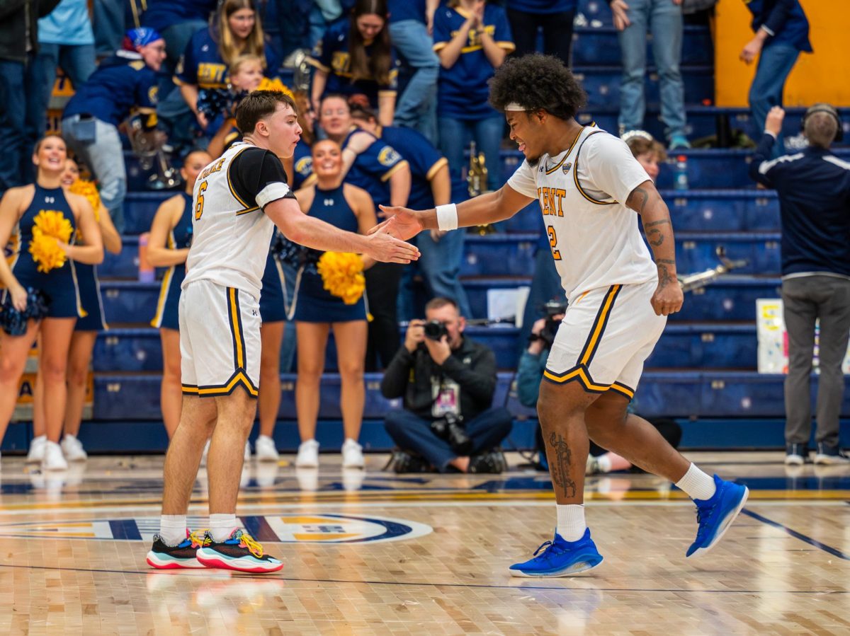 Kent freshman Quinn Woidke, left, and Kent graduate student Rob Whaley Jr., right, celebrate a play made against Miami on Jan. 20, 2026.