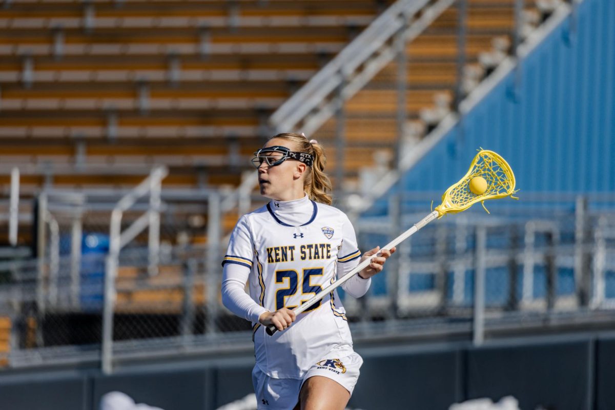 Kent senior Riley Floyd prepares to fire the ball during  their home opening match against Mercyhurst on Feb. 14, 2026.