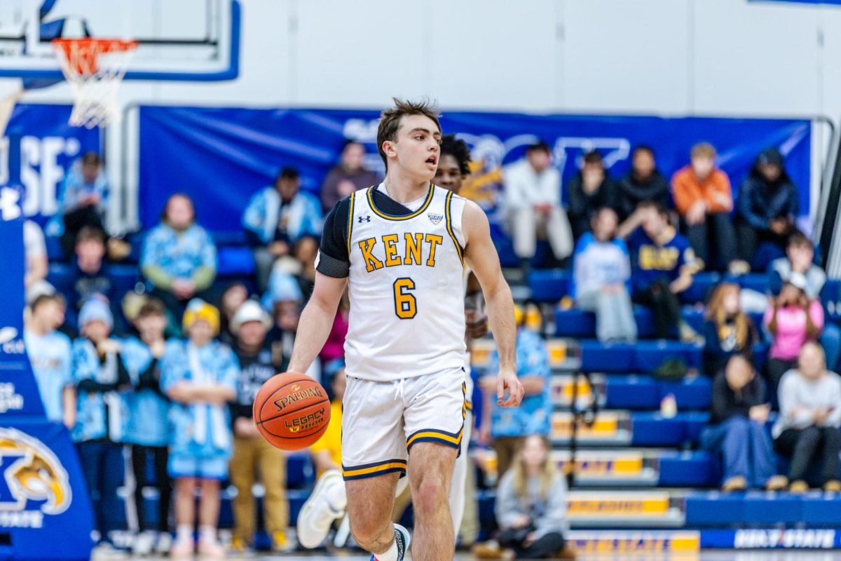 Kent freshman Quinn Woidke brings the ball down the court during the men's basketball game against Central Michigan University on Feb. 24, 2026.