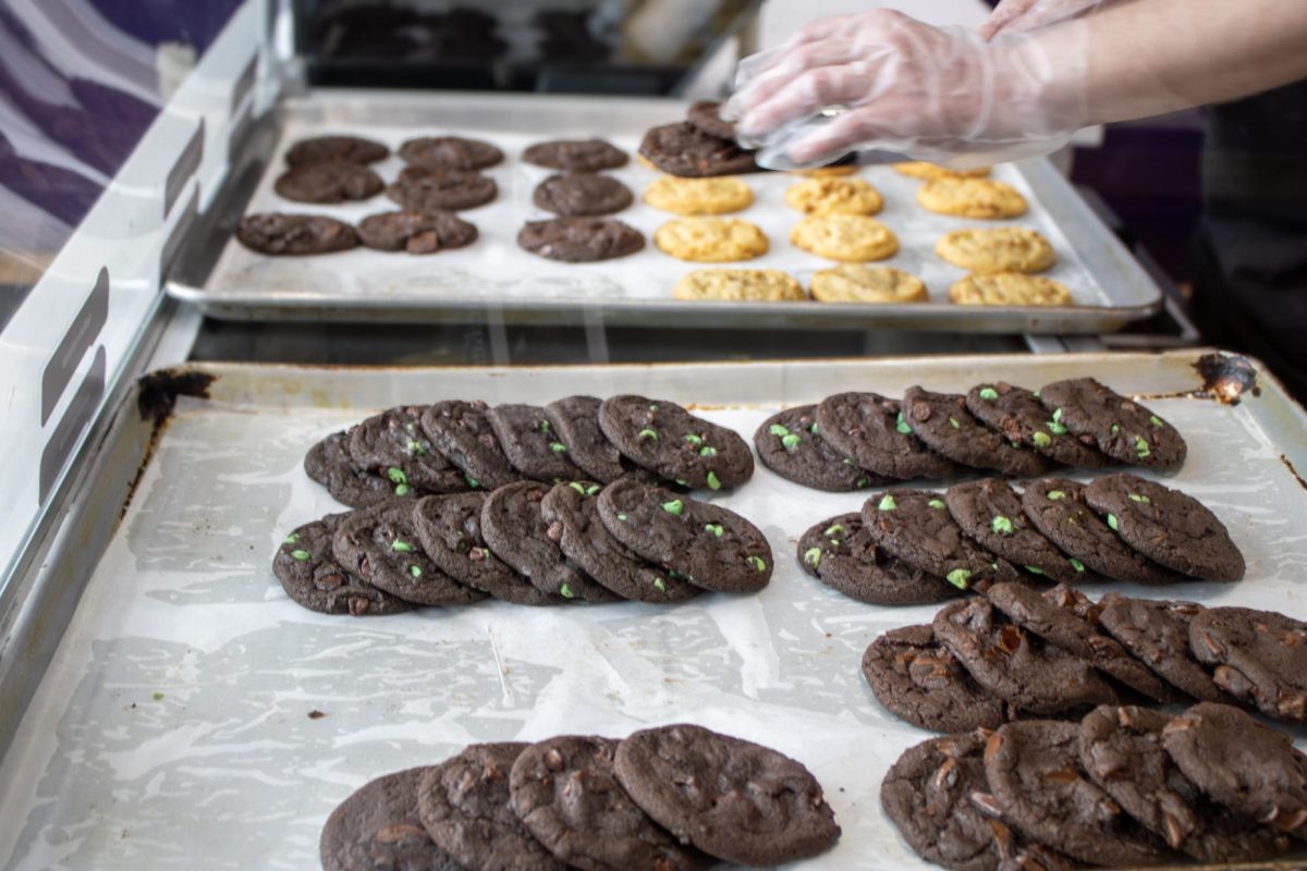 Various flavors of cookies are ready for transfer at Insomnia Cookies located at 295 S Water St on March 30, 2026.