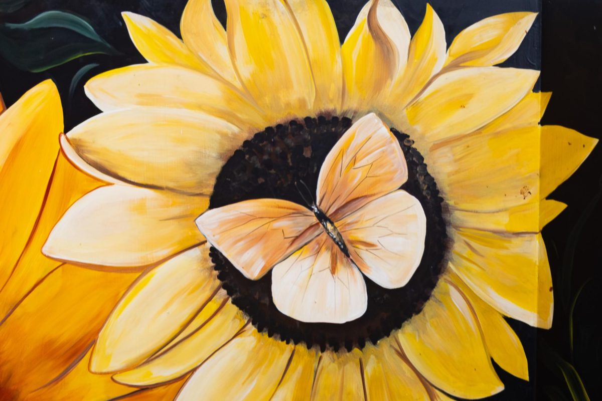 Artwork painted on the back of the booths all around Los Girasoles in Kent, OH.
