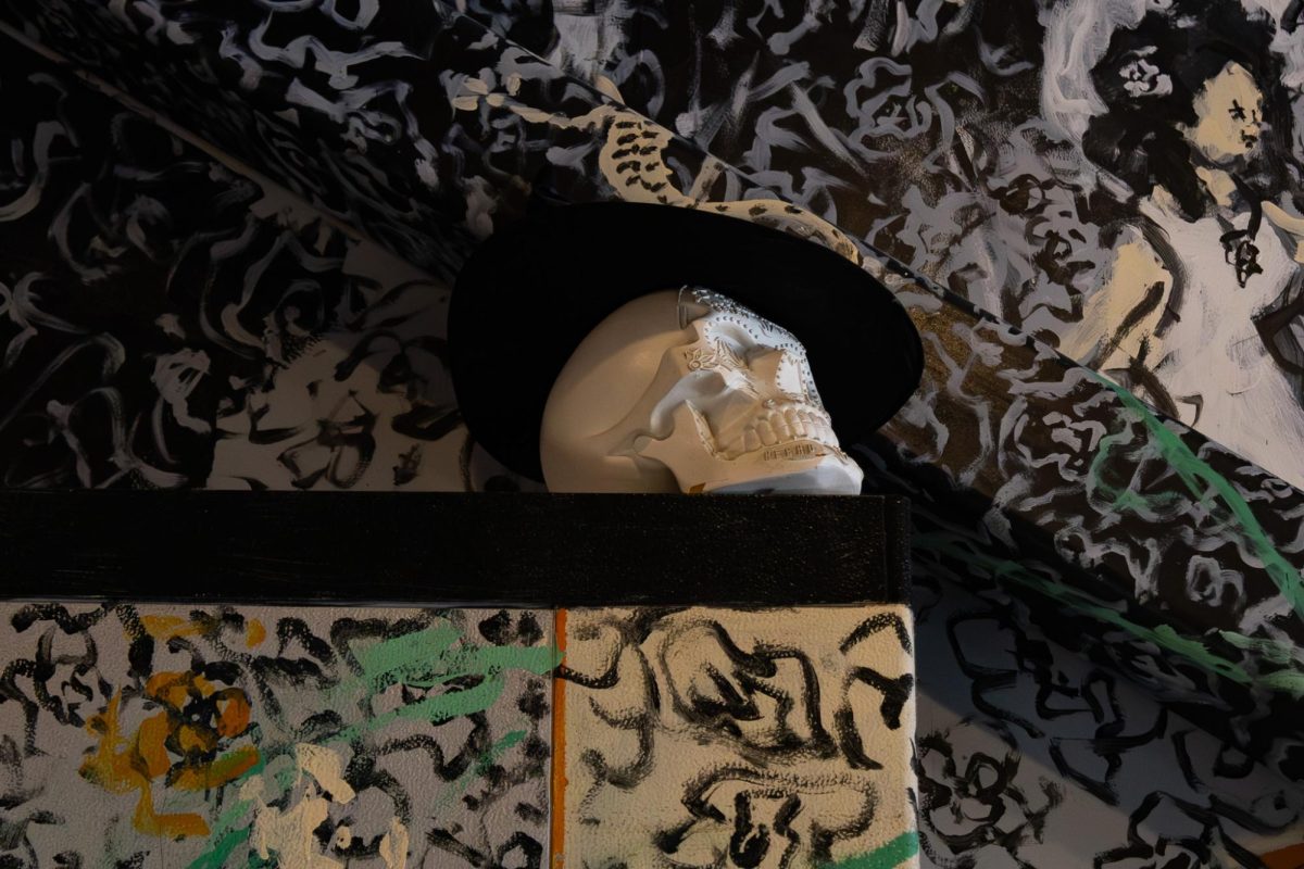Barrio is surrounded by skeleton art inside their restaurant in downtown Kent on March 31, 2026.