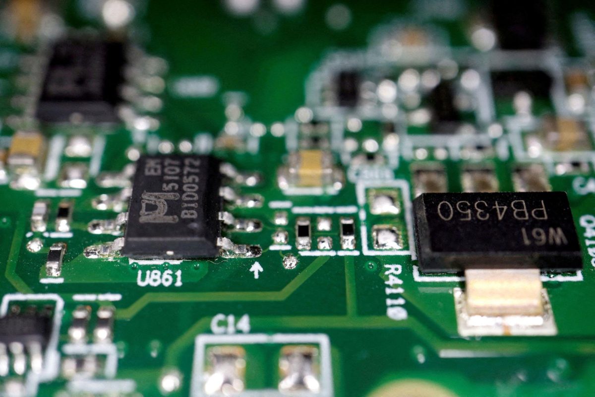Semiconductor chips are seen on a printed circuit board in this photo illustration taken on February 17, 2023.