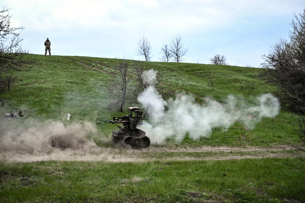 A Ukrainian soldier observes land drone testing operations at a training ground on April 10, 2026.