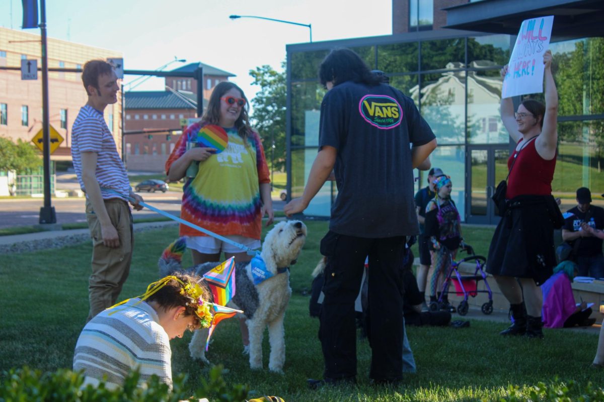 Before a pride parade downtown, individuals were invited to make pride signs at the Kent State Hotel, the starting point. The parade then walked to the gazebo before fizzling out. 